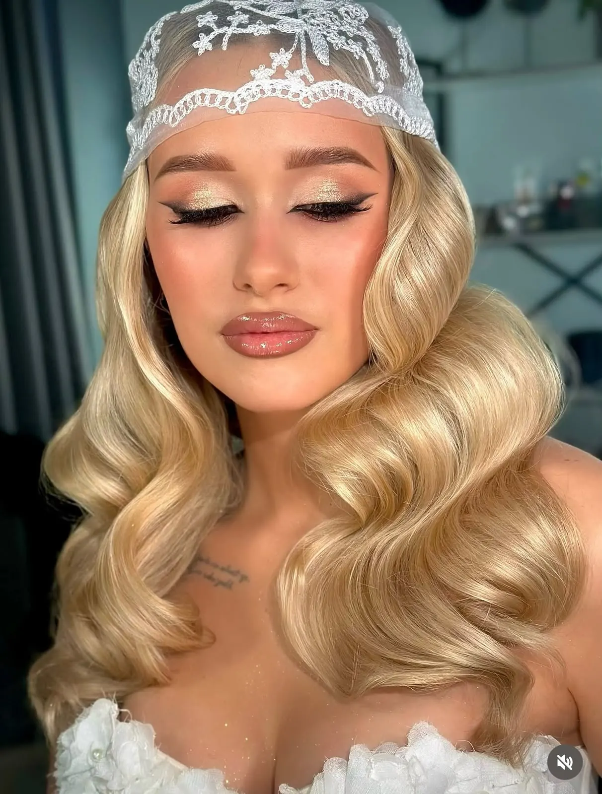 Soft glam makeup with a lace headpiece